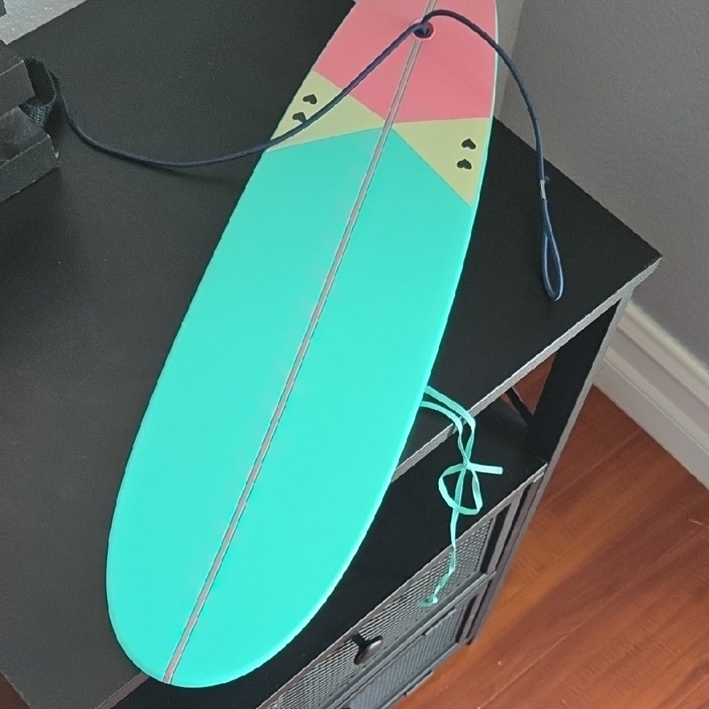 Colorful Surfboard with Pink and Teal Design